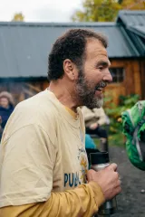 Man smiling drinking from canteen
