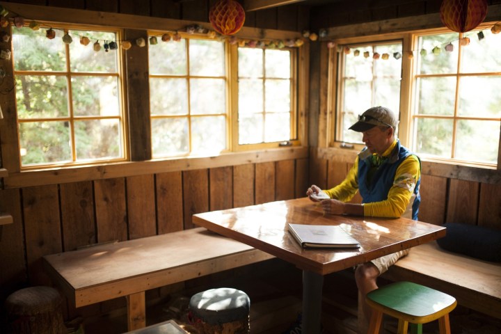 Man Sitting at cabin table