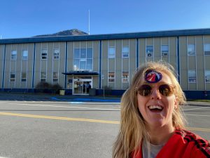 a woman standing in front of a building