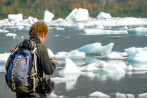 a man holding a fish in the water