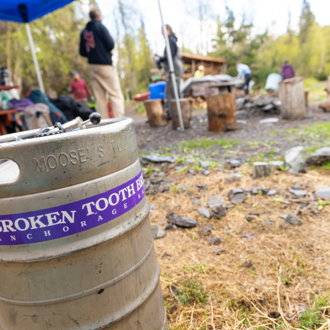 a person standing in front of a barrel